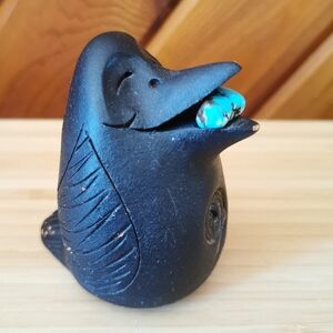 Vintage Southwestern-style pottery raven figurine with turquoise accent